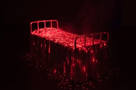 My Modern Met | Bright Red Lights Illuminate a Bed Covered in Eerie Mist