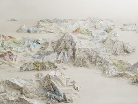 designboom I ji zhou constructs environmental illusions with maps and books
