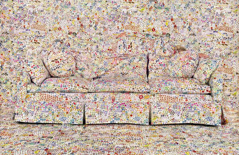 Rachel Perry,&nbsp;Lost in My Life (Fruit Stickers Reclining Behind Sofa),&nbsp;2019. Archival pigment print, 40 x 60 inches.
