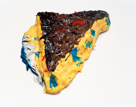 Photograph by Sharon Core. Custard pie with frosting and blue icing arranged to look like the sculpture by Claes Oldenburg