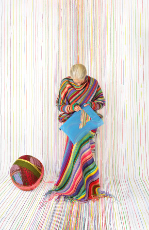 Rachel Perry,&nbsp;Lost in My Life (Needlepoint Sitting Stitching), 2023. Archival pigment print, 30 x 19 1/2 inches.