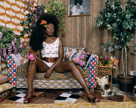 Qusuquzah Sitting with Pink Flower in Hand, 2018, 40 x 50 inch chromogenic print