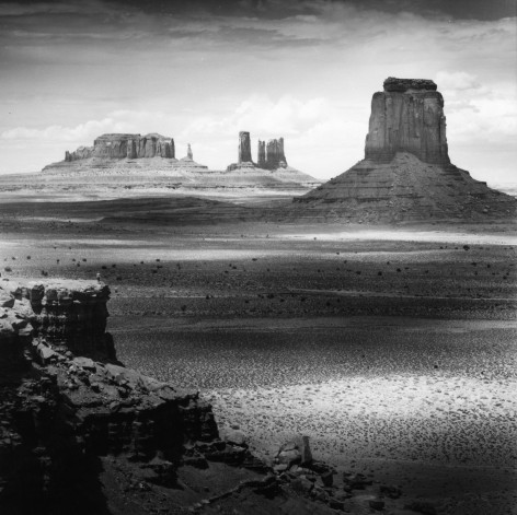 Tseng Kwong Chi,&nbsp;Monument Valley, Arizona, from the series&nbsp;East Meets West, 1987. Sepia-toned gelatin silver print, 14 x 11 inches.