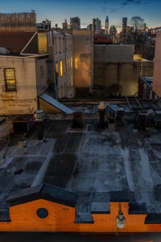 Lynn Saville,&nbsp;Rooftops from Court Square Platform, 2022. Archival pigment print, 33 x 23 inches.