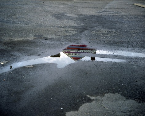 Topless bar reflected in puddle, Doylestown, Pennsylvania, 2010. Archival pigment print, 30 x 40 inches.&nbsp;