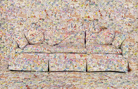 Rachel Perry,&nbsp;Lost in My Life (Fruit Stickers Reclining Behind Sofa), 2019. Archival pigment print, 20 x 30 inches, 40 x 60 inches, or 60 x 90 inches.