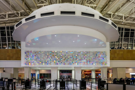 Christian Eckart,  Cloud Room Field, 2015  dichroic glass with anodized aluminum armature and extrusions and stainless steel components;  Hobby International Airport, Houston, Texas;  120 x 720 x 17 inches