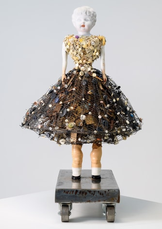 Karin Broker Trouble girl, 2022 Victorian easter basket, porcelain, composite materials, buttons, wire, steel base with wheels 23 1/2 x 18 x 20 inches