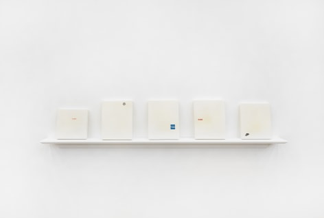 Aaron Parazette Plaster Pure Beauty (Five Works: AmEx, Canon, Lipton, Nike, VW), 1991 plaster with decal 4 works: 10 x 9 inches each; 1 work: 8 x 8 inches