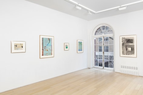 installation view with multiple framed works