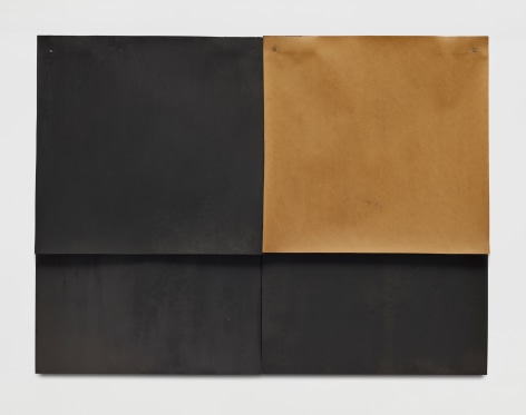 two sheets of black paper with one rectangular cheet of brown paper in the upper right