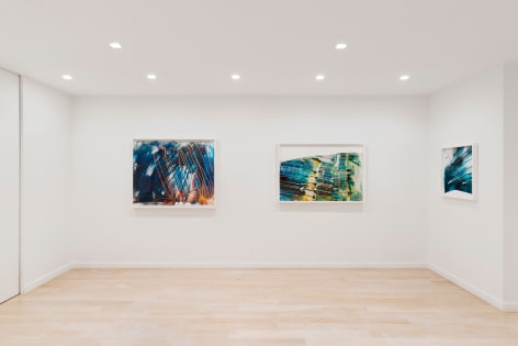 white room with large abstract photos