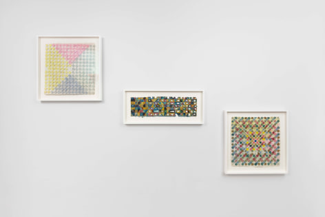 installation view of framed works on paper
