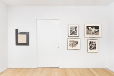 installation view of various framed artworks
