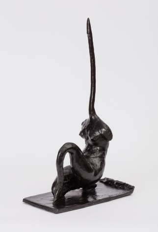 bronze statuette with a long pointy neck