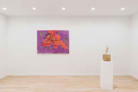 installation view of paintings in a white room