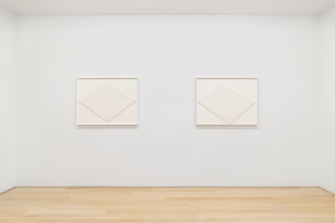installation view with white abstract drawings