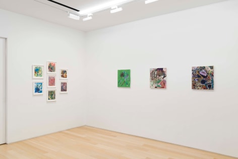 installation view of paintings in a white room