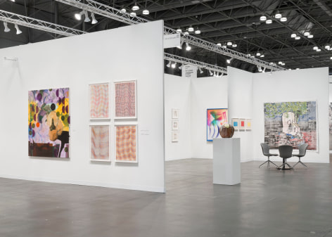 installation view with artworks in a white room