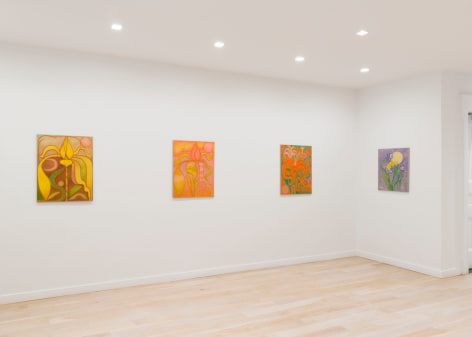 installation view of paintings of flowers