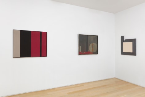 installation view of various framed artworks
