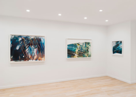white room with large abstract photos