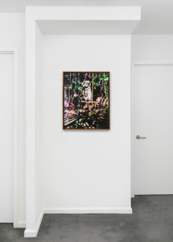 white room with a photo work on the wall