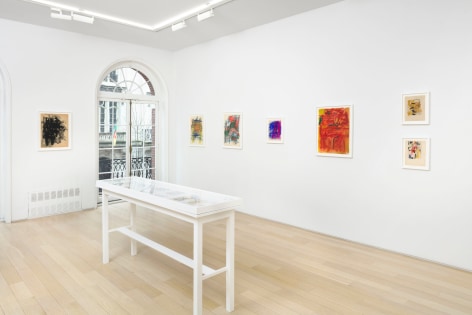 installation view with framed drawings