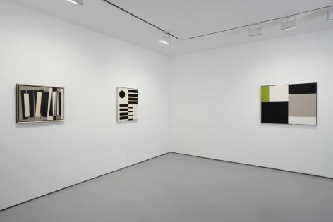 installation view of geometric abstract paintings