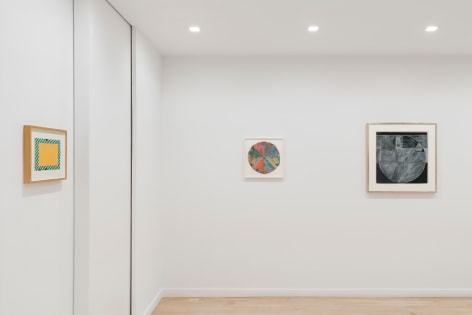 installation view with various framed works