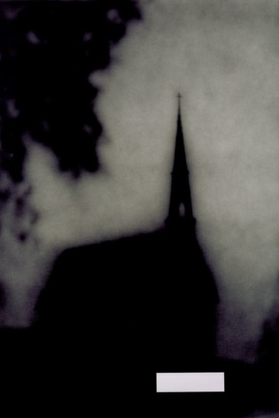 silhouette of a church against a grey background
