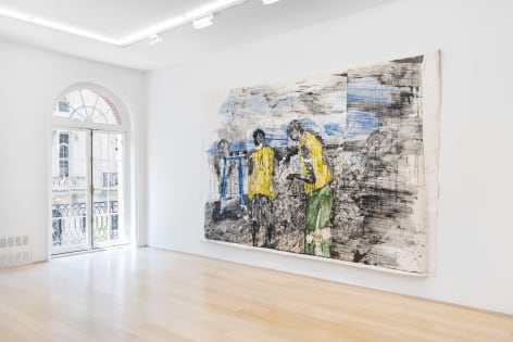 installation view of paintings in a white room