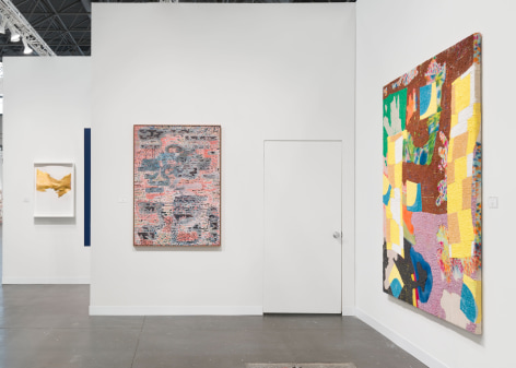 installation view with artworks in a white room