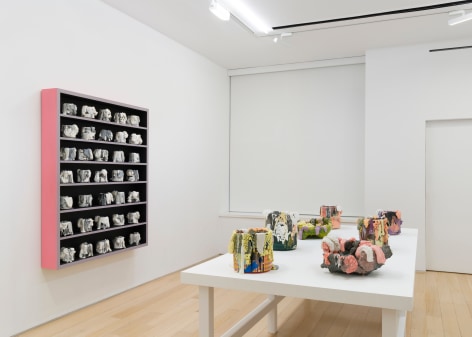 installation view with ceramic vessels