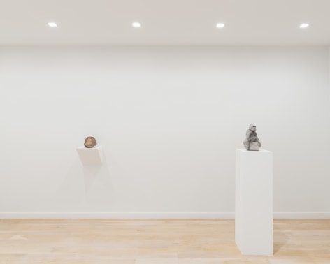 installation view of a white gallery with various sculptures