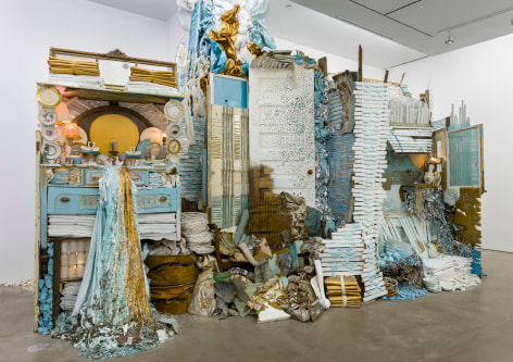 Large installation by Julie Schenkelberg including reclaimed wood and household materials