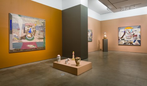 An installation view of paintings and sculptures by Gudmundur Thoroddsen. Large and medium paintings are hung on the wall by ceramic sculptures on pedestals.