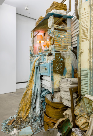 Large installation by Julie Schenkelberg including reclaimed wood and household materials