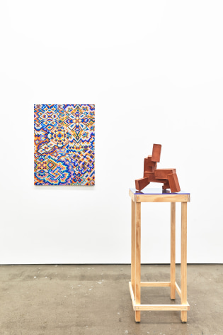 Installation view of works by Todd Kelly. A painting and sculpture are next to one another