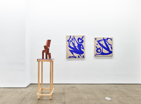 Installation view of works by Todd Kelly. Paintings and sculptures are next to each other.
