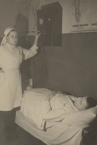Administering electro-therapy in a naval hospital