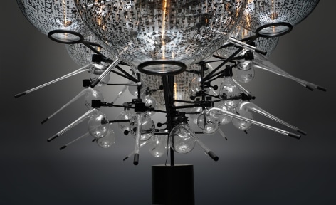 The Genesis Series - Day VII A (detail), 2021, assemblage sculpture with glass beakers, tubes, flasks and domes with engraved, appliqué and printed text; laboratory clamps; icons and iconography, tubular lights and steel base, 297.2 x 152.4 x 152.4 cm (117 x 60 x 60 inches)