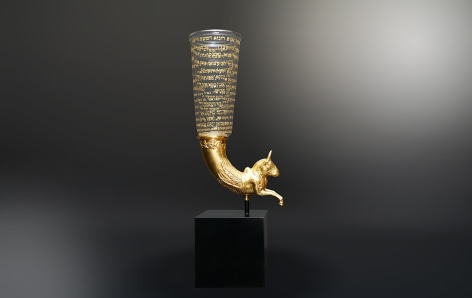 The Moses Cup II, 2019, hand-blown glass vessel with engraved text in-filled with 23-karat gold, 23-karat gold leafed, vintage replica rhyton and steel base, 66 x 25.4 x 17.8 cm (26 x 10 x 7 inches)