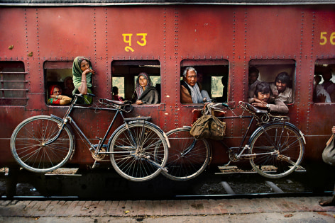 Steve McCurry, Bicycles on Side of Train, India