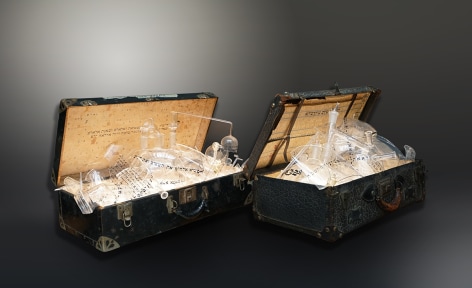 The Genesis Series - Genizah I & II, 2022, vintage suitcase; shattered glass and shards with engraved, appliqué and printed text; and light panel