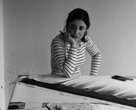 Painter Golnaz Fathi sitting in her studio.