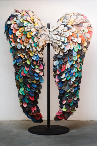 Last Flight, 2009, used slippers and metal stand, 107.3 x 77.2 inches/275 x 198 cm