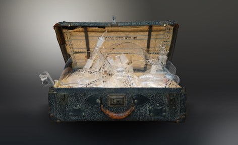 The Genesis Series - Genizah II, 2022, vintage suitcase; shattered glass and shards with engraved, appliqué and printed text; and light panel, 45.7 x 66 x 40.6 cm (18 x 26 x 16 inches)
