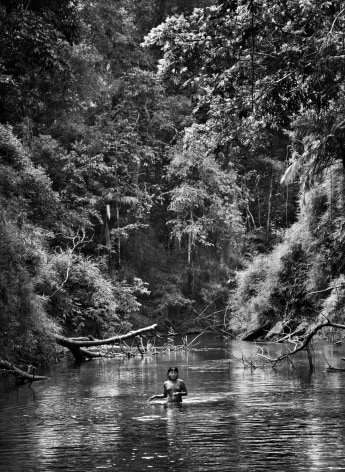 Sebastião Salgado, Young Hatiri bathes in a backwater of the Pretão stream, Suruwahá Indigenous Territory, state of Amazonas, Brazil, 2017, gelatin silver print, 172.7 x 127 cm (68 x 50 inches)