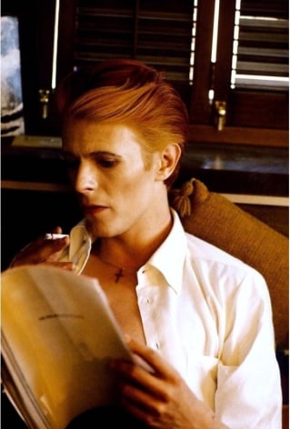 David Bowie reading his script, The Man Who Fell to Earth,&nbsp;Los Angeles, 1974, Archival Pigment Print
